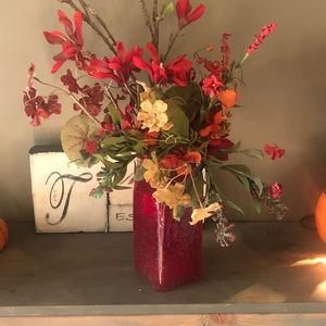 Red glass vase and flowers